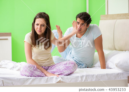 Woman and man in the bedroom during conflict Woman and man in the bedroom during conflict 43953233