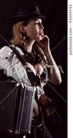 Sexy girl wearing steampunk costume with suitcase Sexy girl wearing steampunk costume with suitcase 43954743
