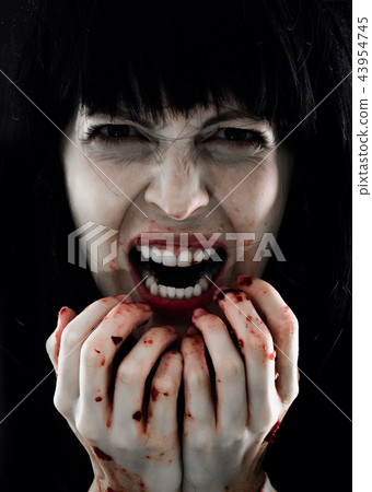 Halloween horror. Crazy bloody scary zombie woman 43954745