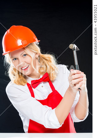 Vertical portrait of a charming chef in helmet Vertical portrait of a charming chef in helmet 43955021