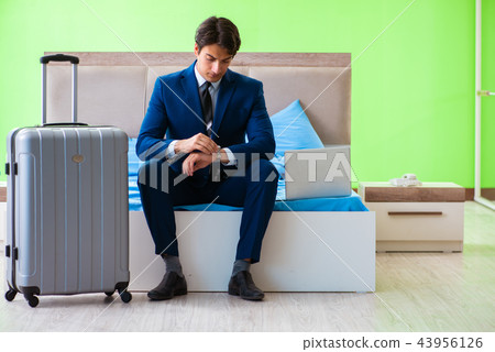 Businessman working in the hotel room Businessman working in the hotel room 43956126