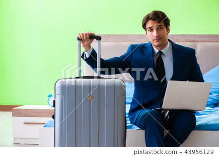 Businessman working in the hotel room Businessman working in the hotel room 43956129