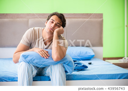 Man suffering from sleeping disorder and insomnia Man suffering from sleeping disorder and insomnia 43956743