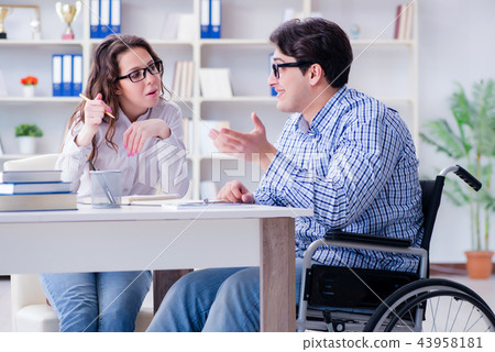 Disabled student studying and preparing for college exams 43958181