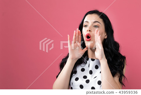 Young woman shouting Young woman shouting 43959336