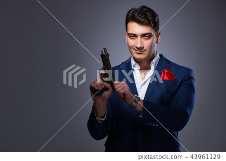 Handsome man against gray background 43961129