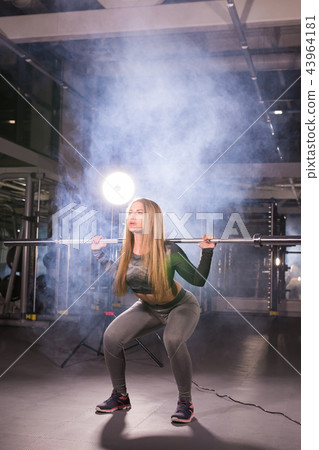 sport, fitness, training and happiness concept - sporty woman with barbell in gym sport, fitness, training and happiness concept - sporty woman with barbell in gym 43964181