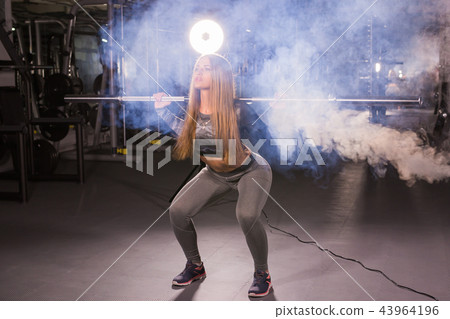 sport, fitness, training and happiness concept - sporty woman with barbell in gym sport, fitness, training and happiness concept - sporty woman with barbell in gym 43964196