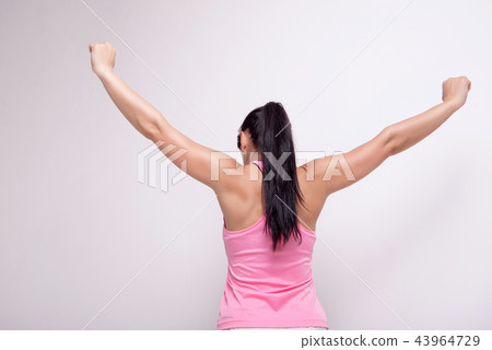 Beautiful athletic woman wearing in sports style clothing makes sports exercis . 43964729