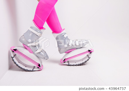 close-up in kangoo jumps boots indoors unrecognizable rear view. 43964737