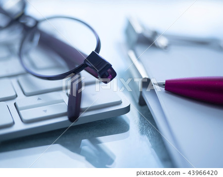 Business image · document · keyboard · glasses · female 43966420