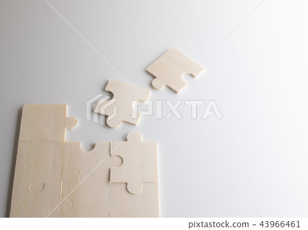 Last piece of wooden jigsaw is for business Last piece of wooden jigsaw is for business 43966461