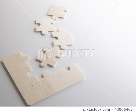Last piece of wooden jigsaw is for business  43966462