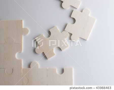 Last piece of wooden jigsaw is for business  43966463