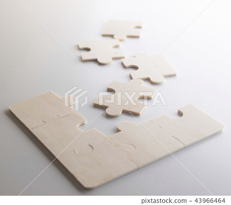 Last piece of wooden jigsaw is for business  43966464