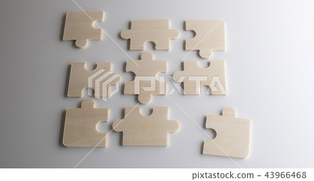 Last piece of wooden jigsaw is for business  43966468