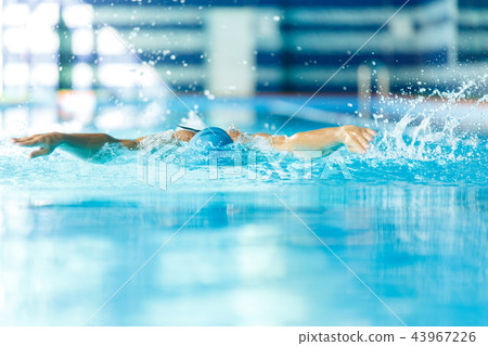 Photo of athlete man sailing down path in pool in training 43967226