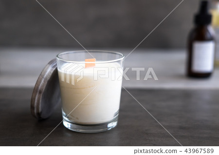 Concrete scented soy round candle on grey table 43967589