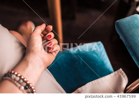 Red gel nail polish manicured woman's hand Red gel nail polish manicured woman's hand 43967599