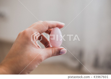 Woman holds yoni egg in hand 43967601