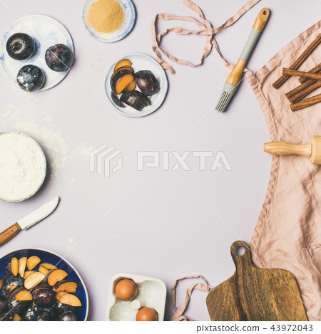 Baking ingredients and tools over pastel background, square crop Baking ingredients and tools over pastel background, square crop 43972043