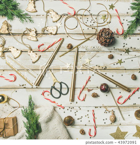Flat-lay pattern of holiday decoration objects, toys, candles Flat-lay pattern of holiday decoration objects, toys, candles 43972091