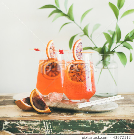 Aperol Spritz alcohol cocktail with orange and ice, square crop Aperol Spritz alcohol cocktail with orange and ice, square crop 43972112