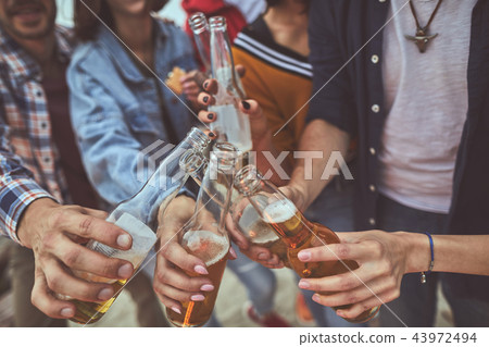 Folks making their evening better with alcohol drink 43972494