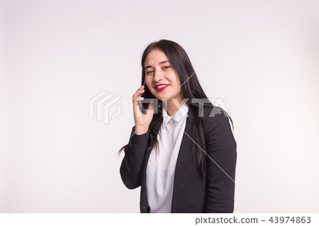 Communication and people concept - young brunette woman talking on mobile and smiling on white 43974863