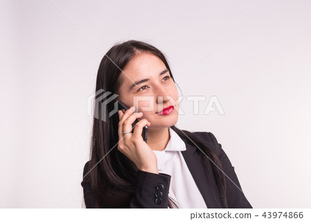 Technology, smartphone and people concept - Smiling young student woman talking on phone Technology, smartphone and people concept - Smiling young student woman talking on phone 43974866