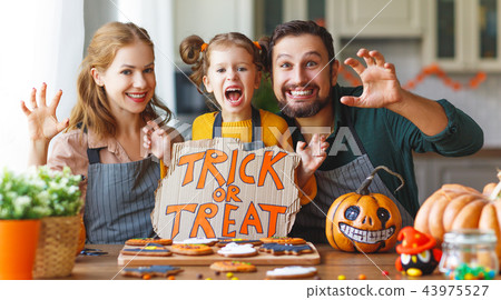 happy Halloween! family mother, father and daughter getting read happy Halloween! family mother, father and daughter getting read 43975527