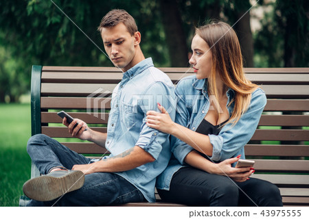 Phone addicted people, man ignoring his woman 43975555