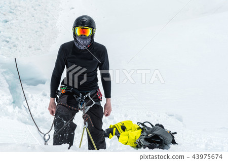Mountain guide candidate training ice axe and rope skills on a glacier in the North Caucasus Mountain guide candidate training ice axe and rope skills on a glacier in the North Caucasus 43975674