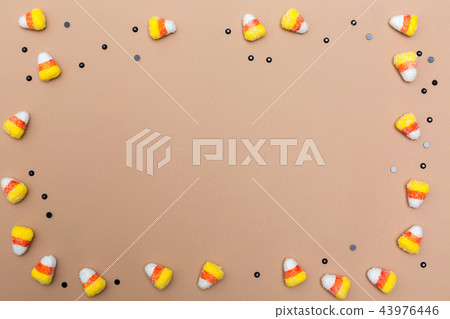 Halloween theme with candies on brown paper 43976446