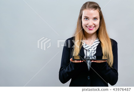 Young woman with a tablet computer Young woman with a tablet computer 43976487