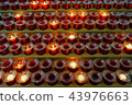 Many lighted candles in candlesticks. Sacred light 43976663