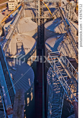 Modern silos for storing grain harvest. Agriculture. Background. Modern silos for storing grain harvest. Agriculture. Background. 43976712