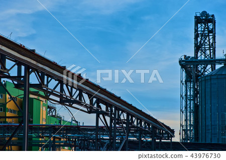 Modern silos for storing grain harvest. Agriculture. Background. Modern silos for storing grain harvest. Agriculture. Background. 43976730