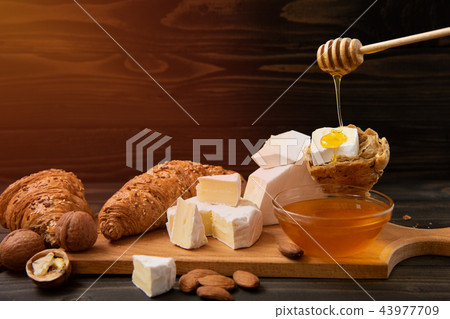 slices of cheese brie or camembert with croissants slices of cheese brie or camembert with croissants 43977709