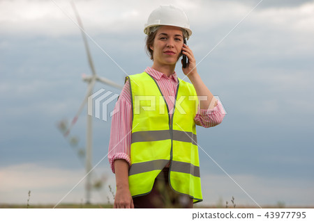 Concept of engineers and windmills Concept of engineers and windmills 43977795