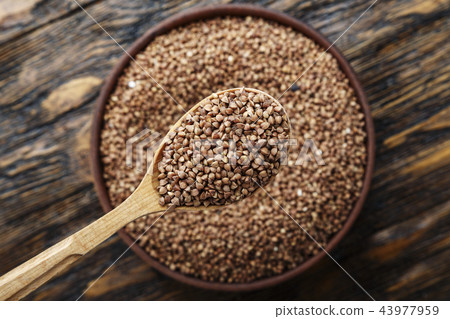 raw buckwheat in a plate 43977959