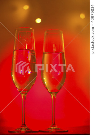Champagne glass in disco party bar Champagne glass in disco party bar 43979834