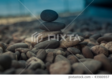 Stones stacked - esoteric symbol of balance and equilibrium Stones stacked - esoteric symbol of balance and equilibrium 43980937