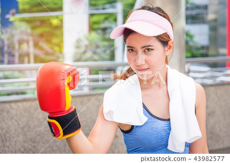 Sport woman boxing in street city Sport woman boxing in street city 43982577