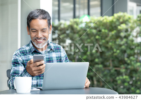 Smiling happy mature man with white stylish 43984627