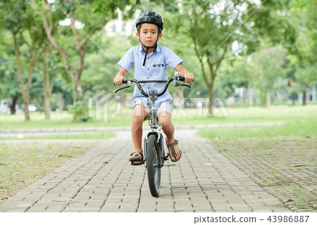 Cycling boy Cycling boy 43986887