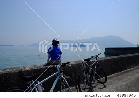 Hyotan Island and female cyclist Shimanami Kaido Omijima 43987949