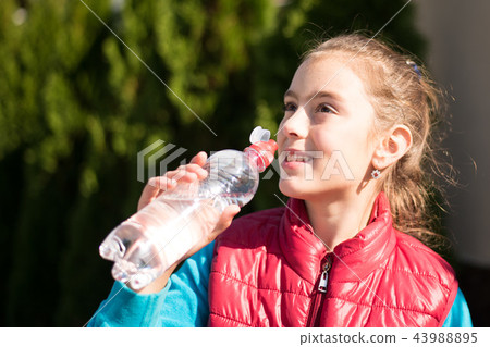 Girl drink water 43988895