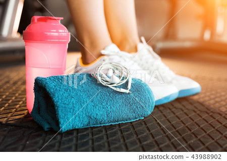 girls feet wearing sneakers in a fitness club girls feet wearing sneakers in a fitness club 43988902