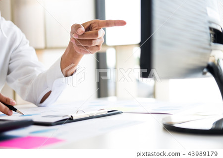 businessman working together pointing screen while discussing ex businessman working together pointing screen while discussing ex 43989179